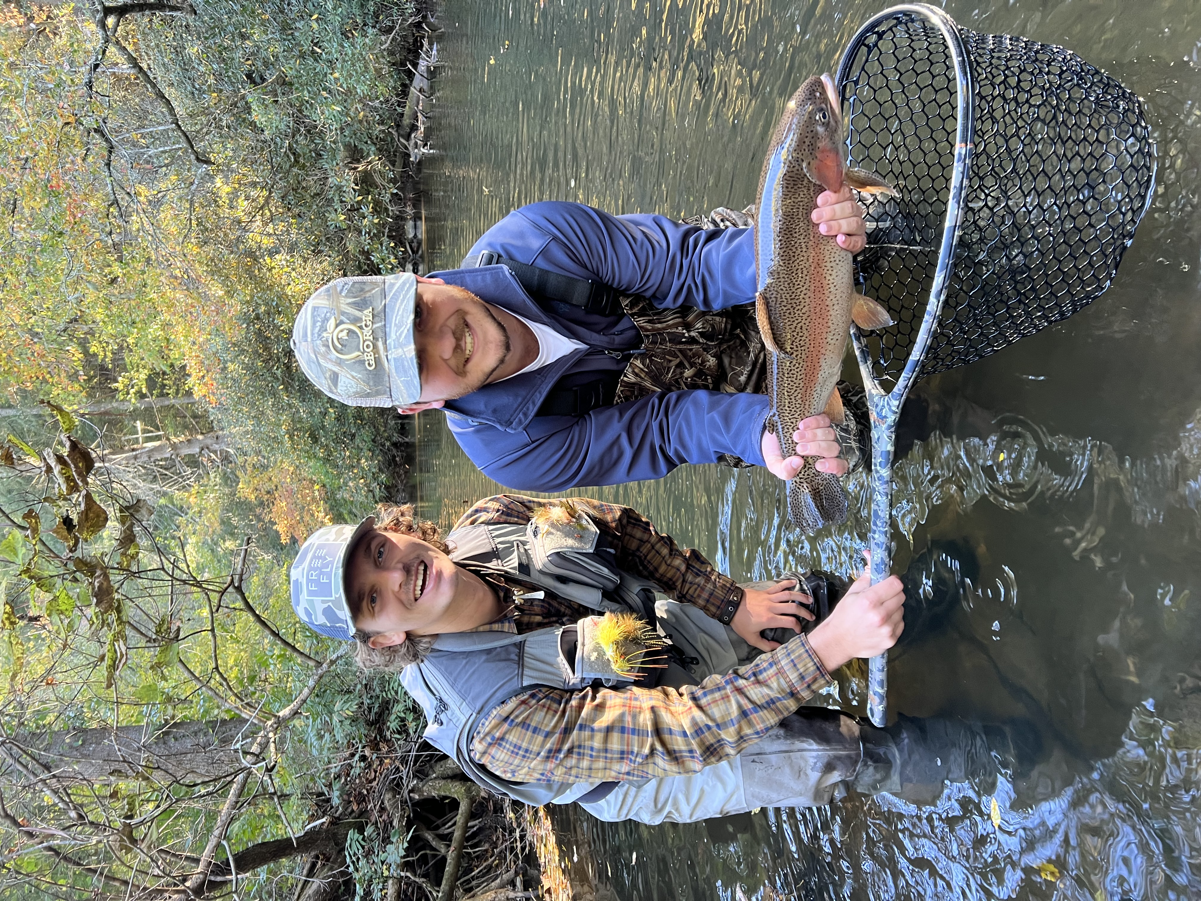 An angler holding a trophy trout